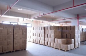 Stacked shipping cartons neatly arranged in a warehouse, ready for dispatch.