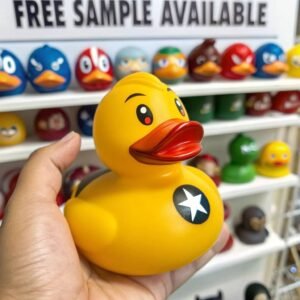 Superhero-themed rubber duck with a star on its chest, held in a hand, with other rubber ducks in the background.