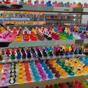 Colorful rubber duck collection on display shelves